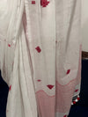White cotton saree with red buti motifs and striped border